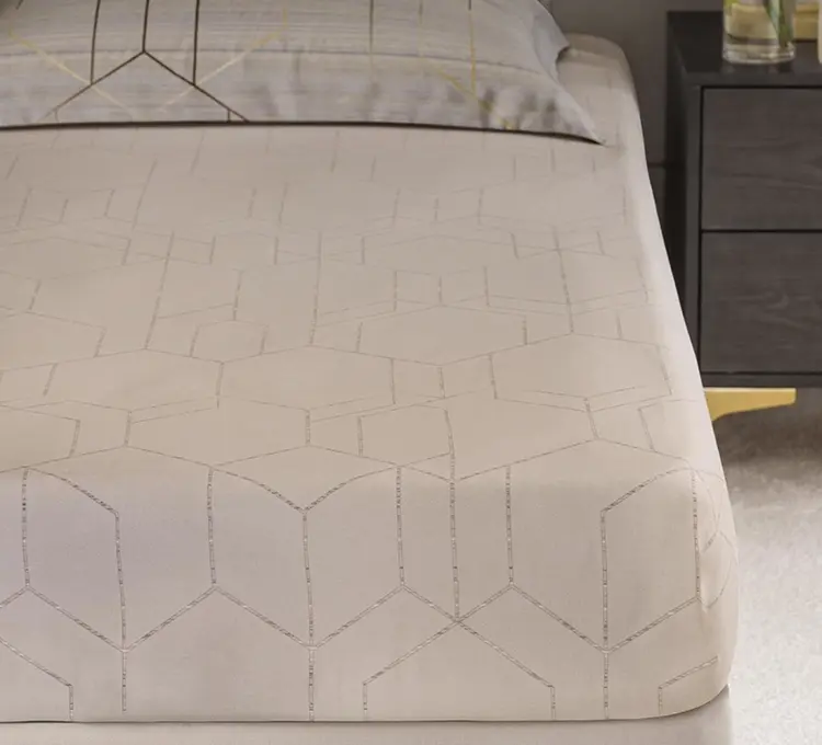 Luxury bed sheet with subtle sheen in champagne color